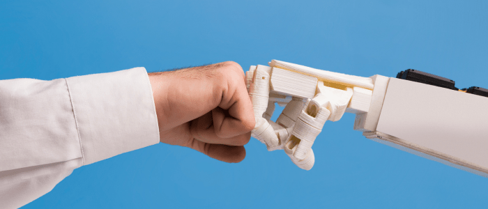 Image of two arms, one a man in a labcoat, one a robot, fistbumping. To show the concept of a new partnership to form a real-world data platform integrating AI and EMR