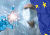 A person in a lab coat, hairnet and face mask holds up a test tube with the symbols for DNA, atoms and various chemical compounds superimposed over it. To represent concerns over EU HTA guidance impacting ATMPs.